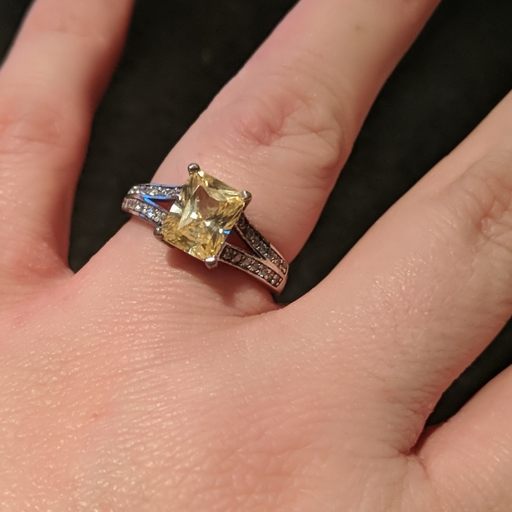 Sterling silver ring with yellow emerald cut stone